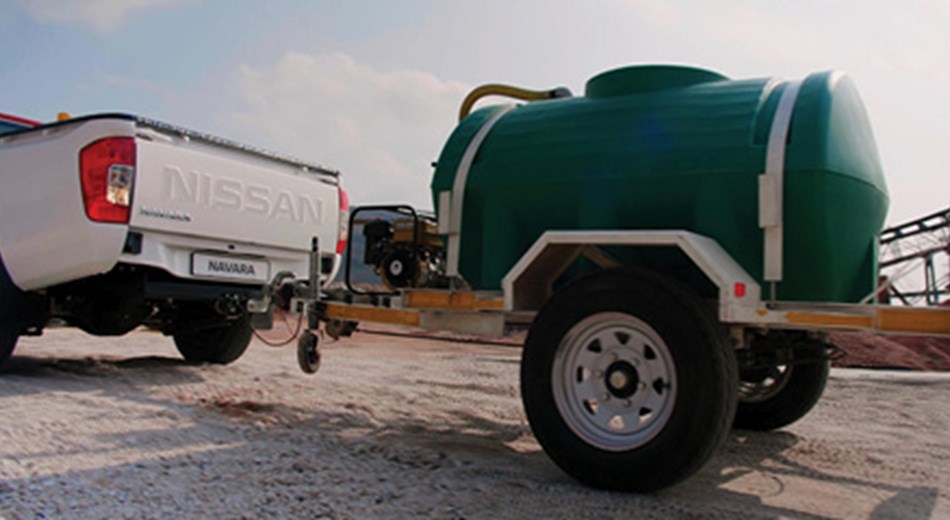 Navara single cab pulling a trailer with water tank on it